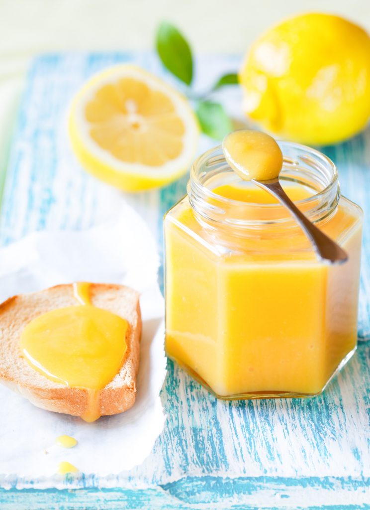 vegan lemon curd being spread on toast