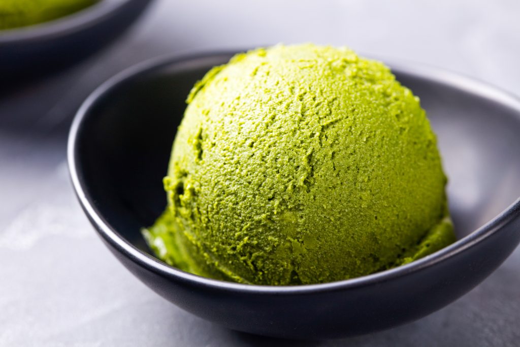 vegan green tea ice cream in a black bowl