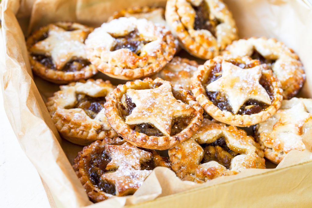 storing vegan mince pies in a box with gold paper 