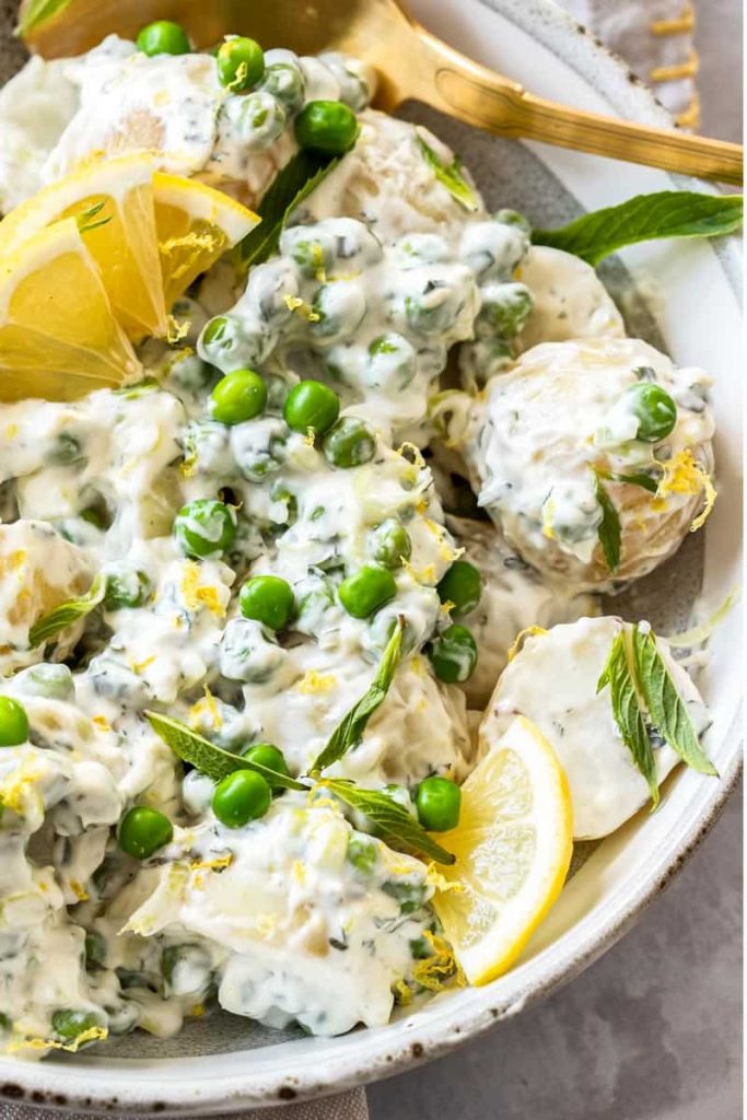 Photo of potato salad with peas and mint.