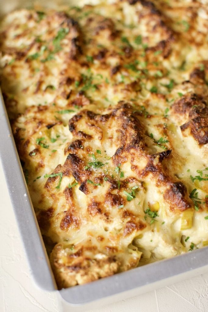 Photo of cauliflower and leek gratin in a casserole dish.