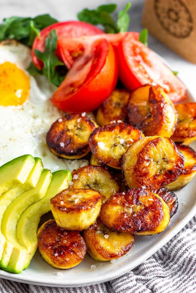 Photo of a white dish serving Fried Sweet Plantains.