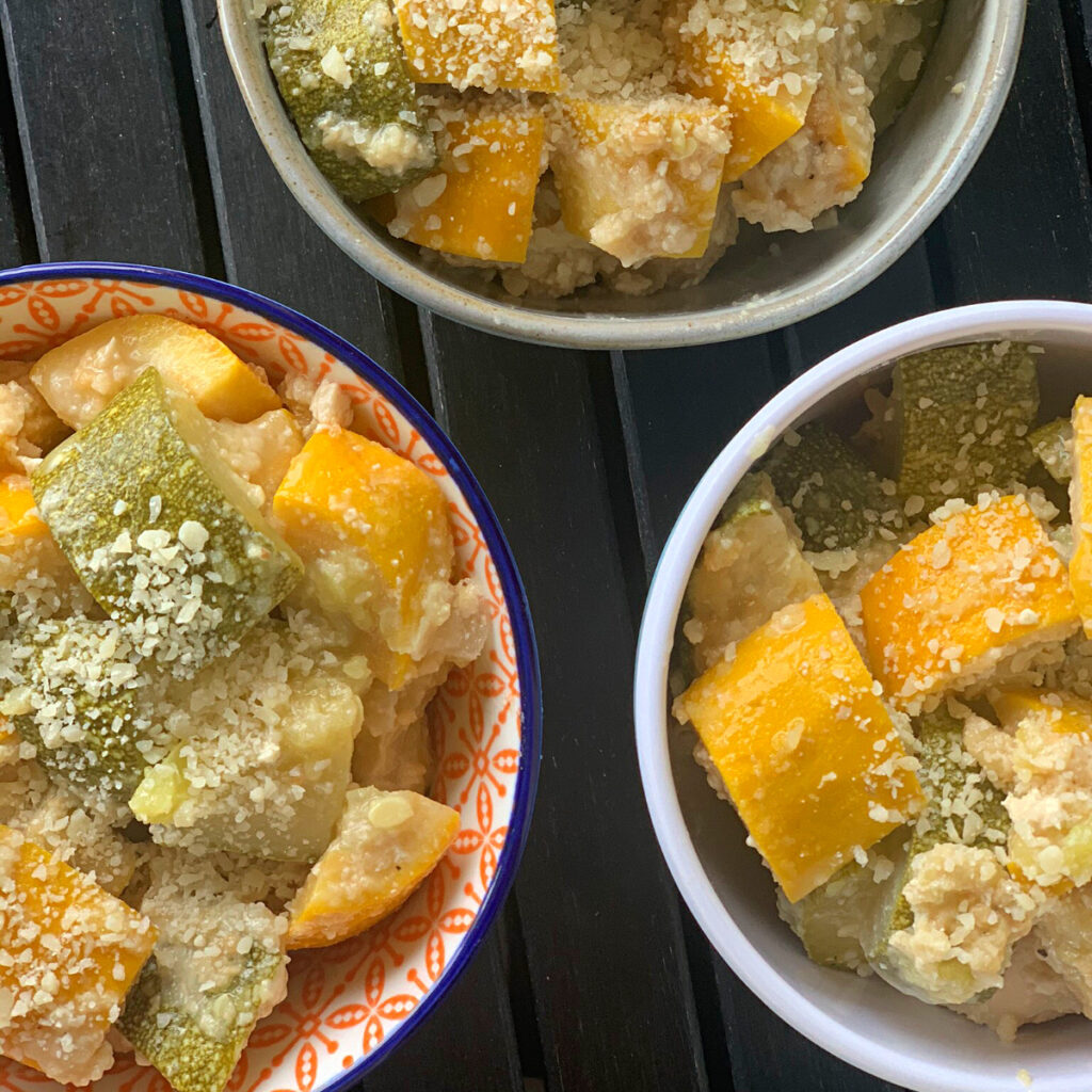 Photo of Lazy Squash & Zucchini Parmesan being served in three bowls.