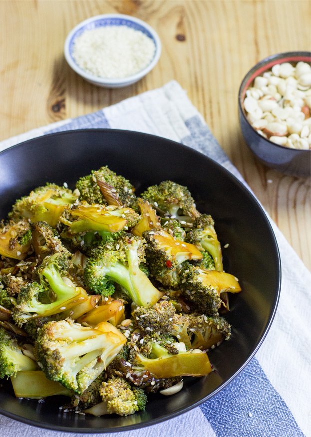 Photo of a bowl serving vegan broccoli salad which is one of the healthiest sides for stuffed peppers.