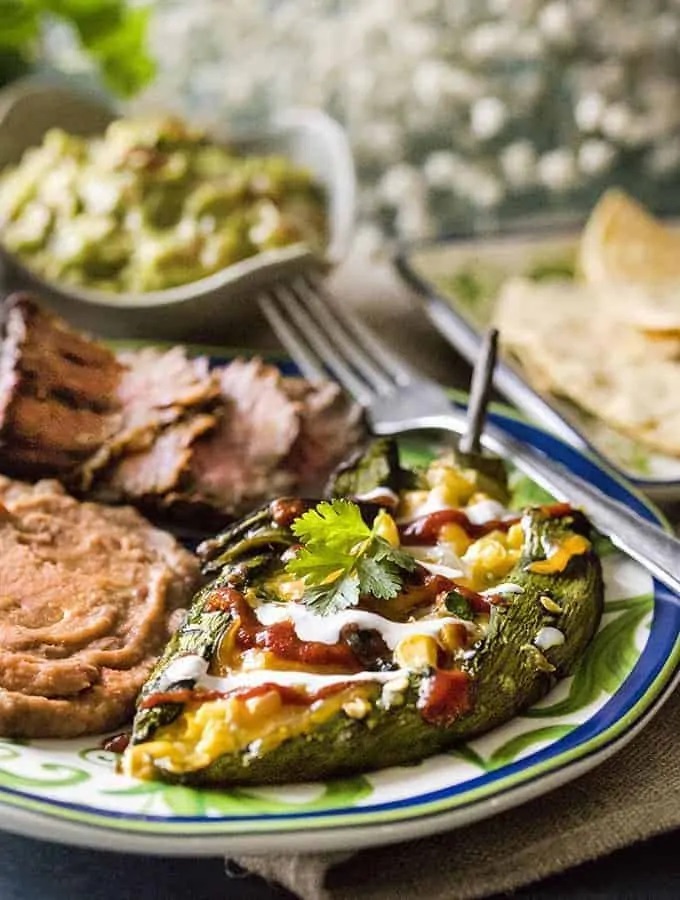 Photo of air fryer chile rellenos being served on a colorful plate.  