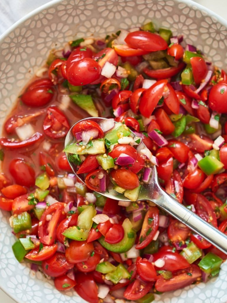 Photo of Pico de Gallo being served in a white bowl.