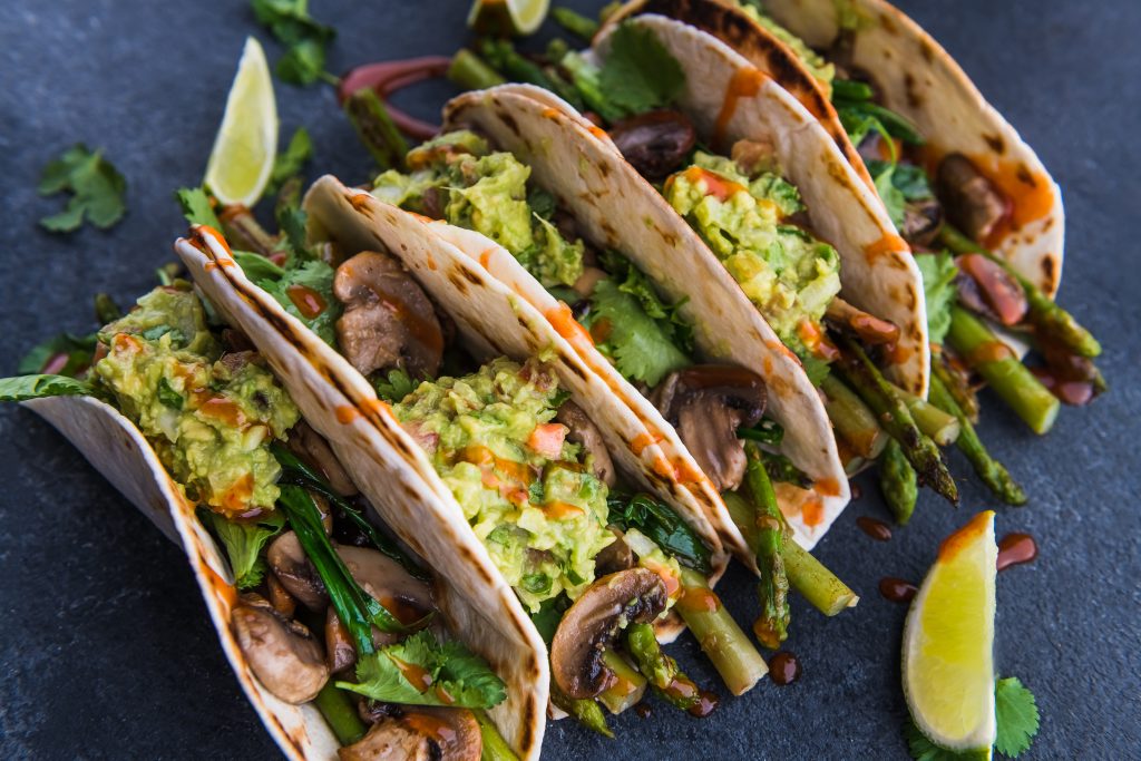 Photo of veggie tacos with lime wedges