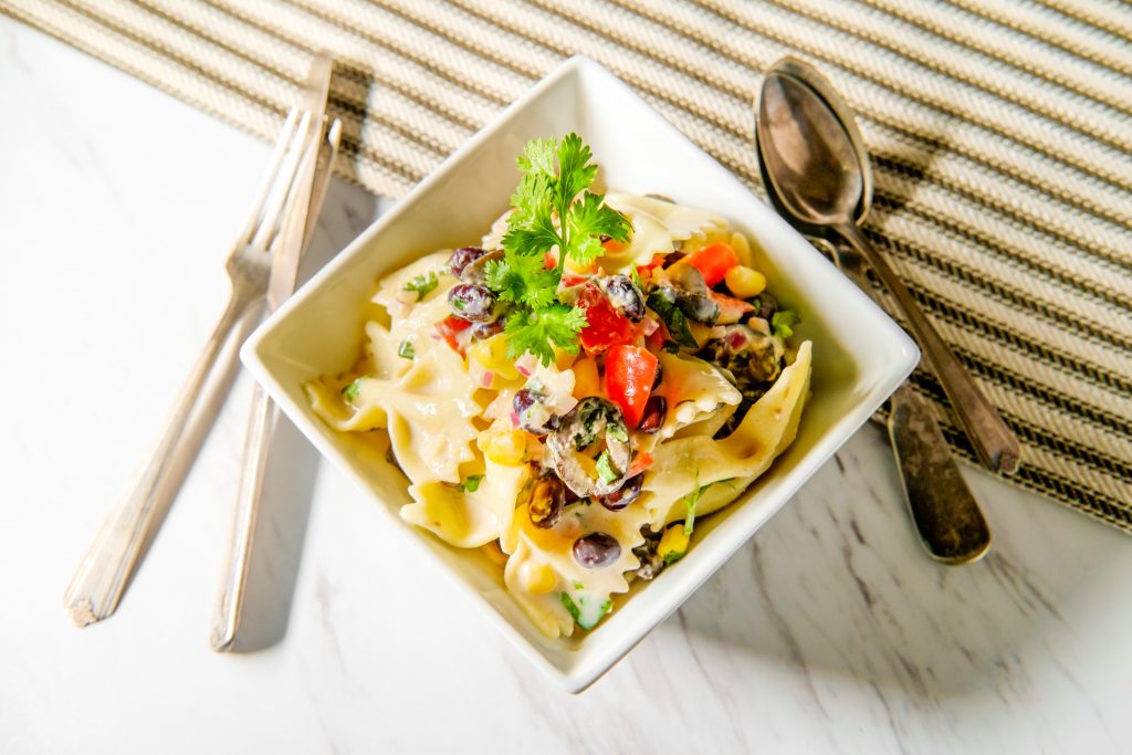 above view of a mexican street corn pasta salad in a bowl