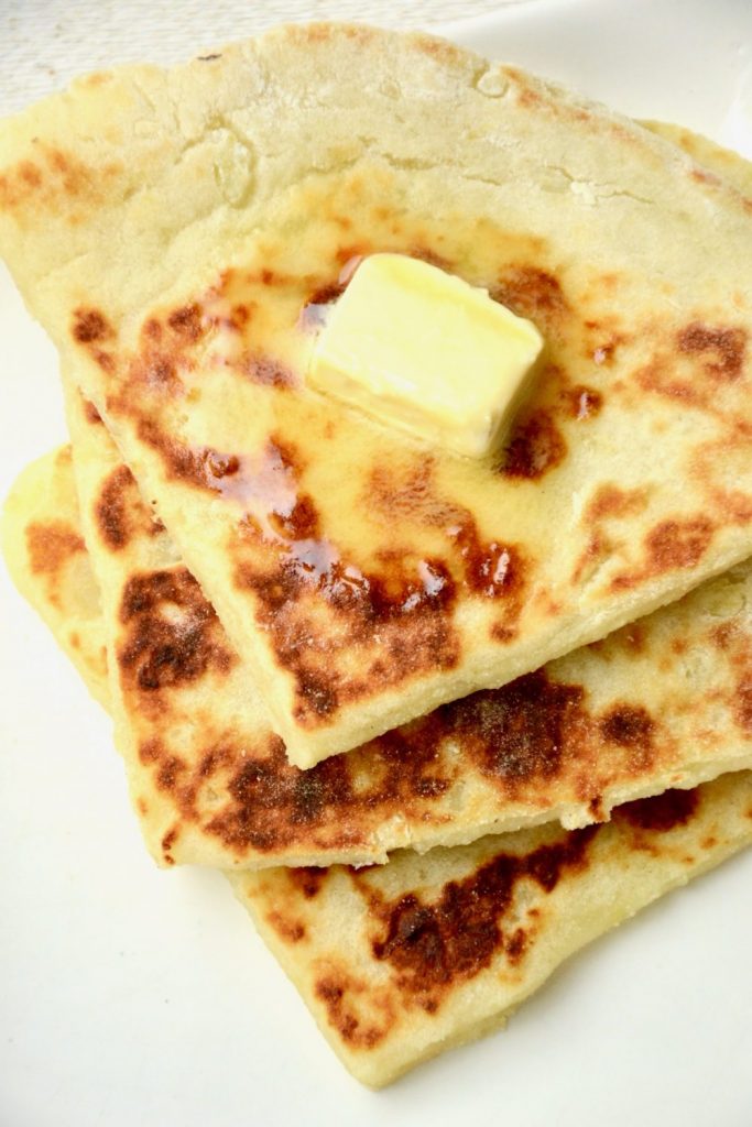 Photo of three potato scones with melting vegan butter