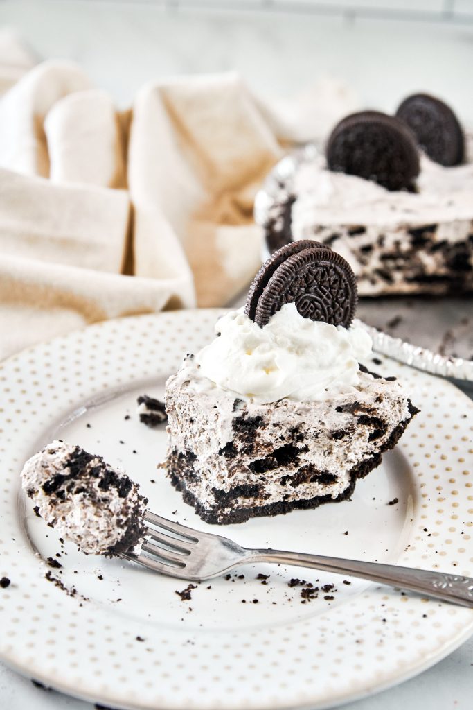 fork taking a piece out of vegan Oreo cheesecake