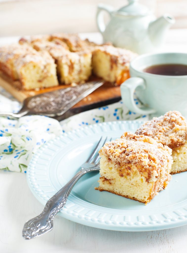 close up of vegan coffee cake on a light blue plate