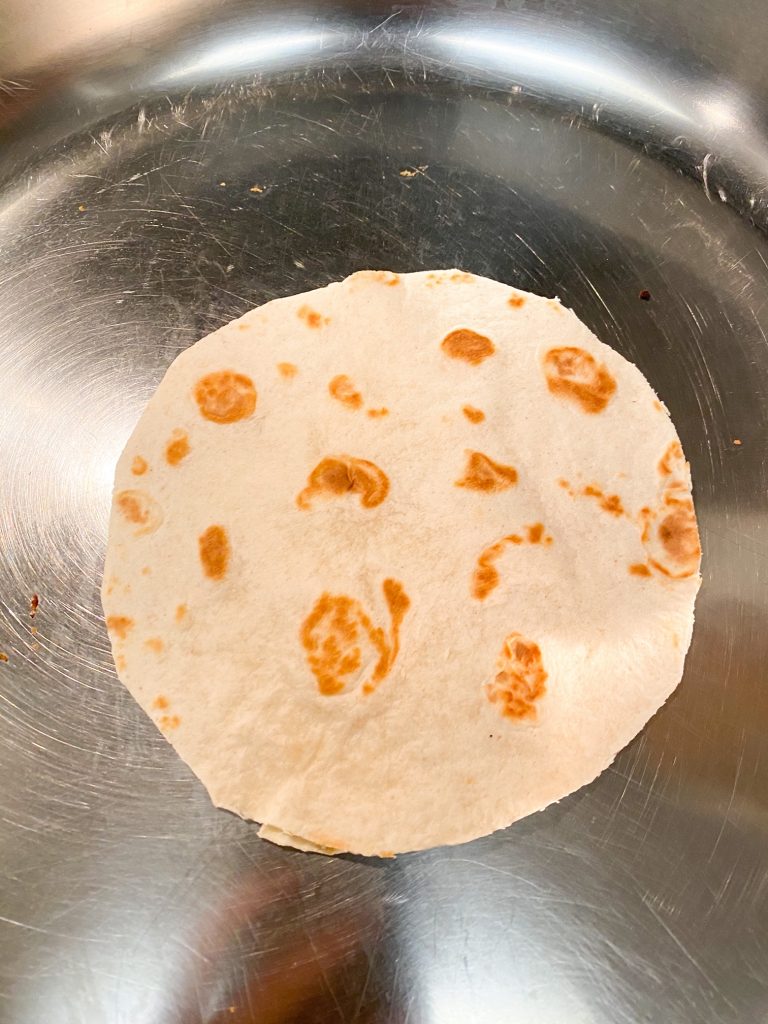 tortilla round on a frying pan