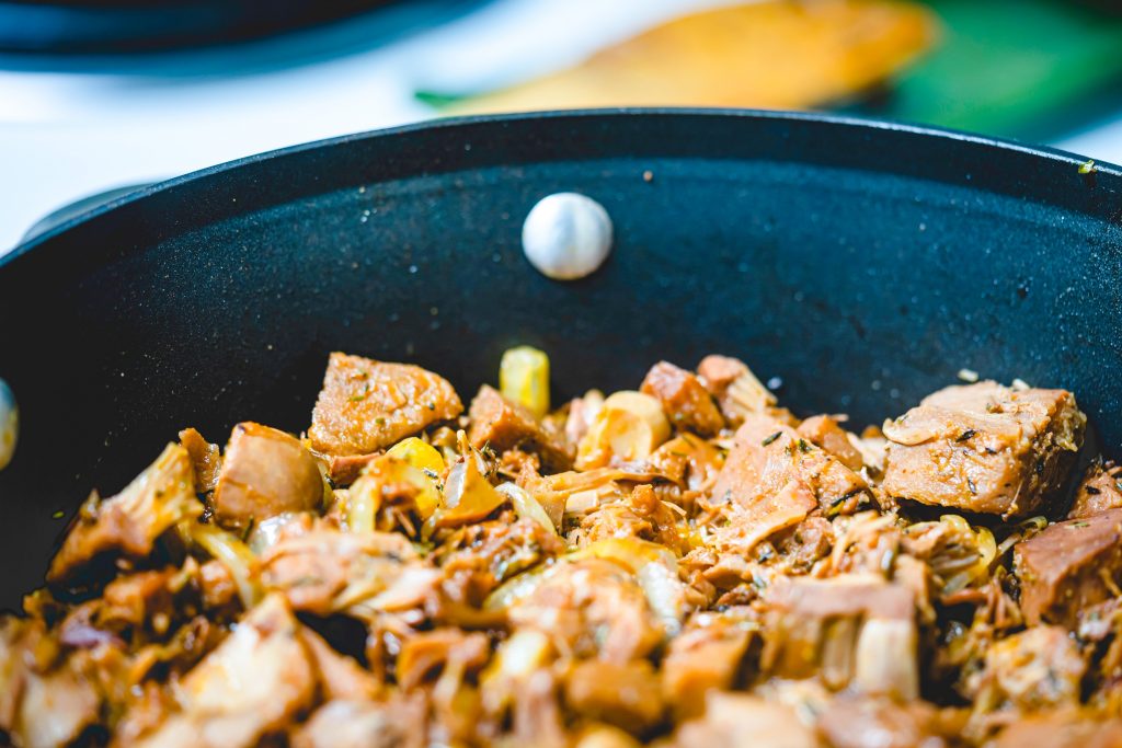 cooking jackfruit in a pan with veggies