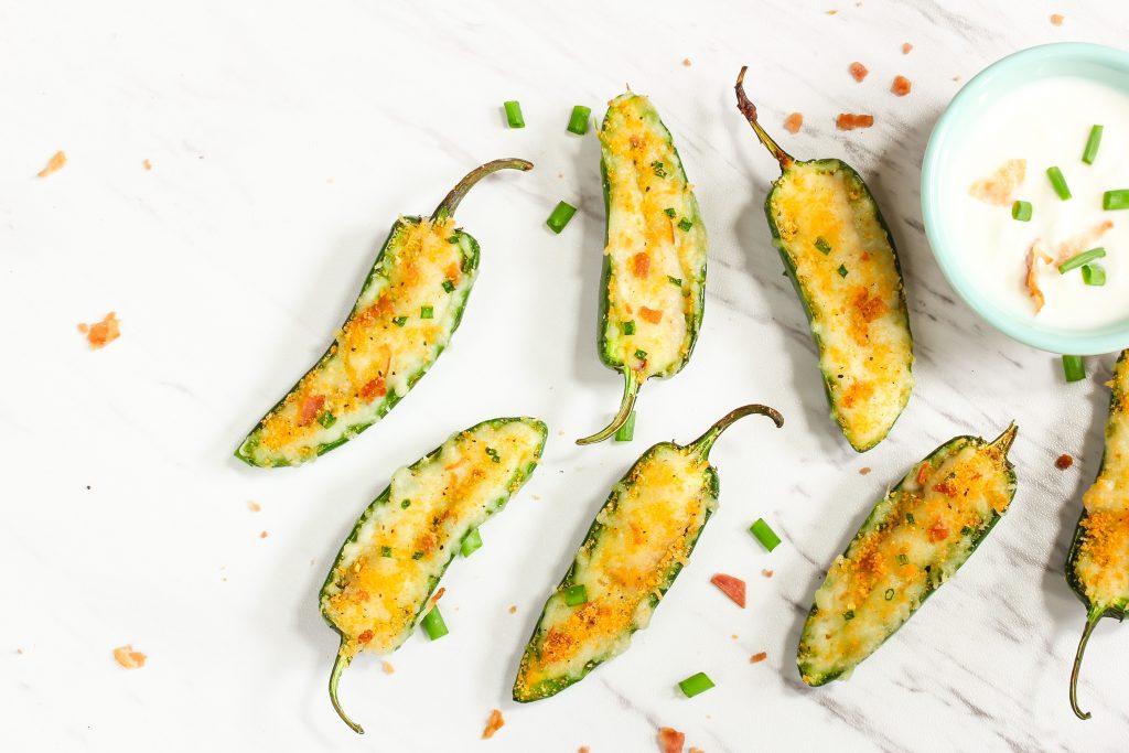 vegan jalapeno poppers with vegan sour cream dip and vegan bacon bits