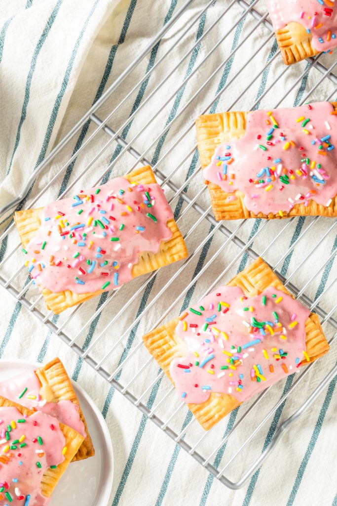 strawberry flavored vegan pop tarts on a cooling rack