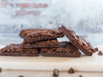 fudgy vegan brownies on a pan up close