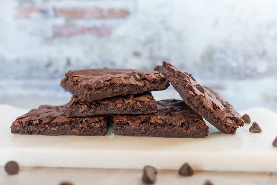 fudgy vegan brownies on a pan up close