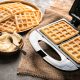 waffle maker with removable plates with two waffles and butter