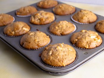 apple walnut muffins in muffin tin