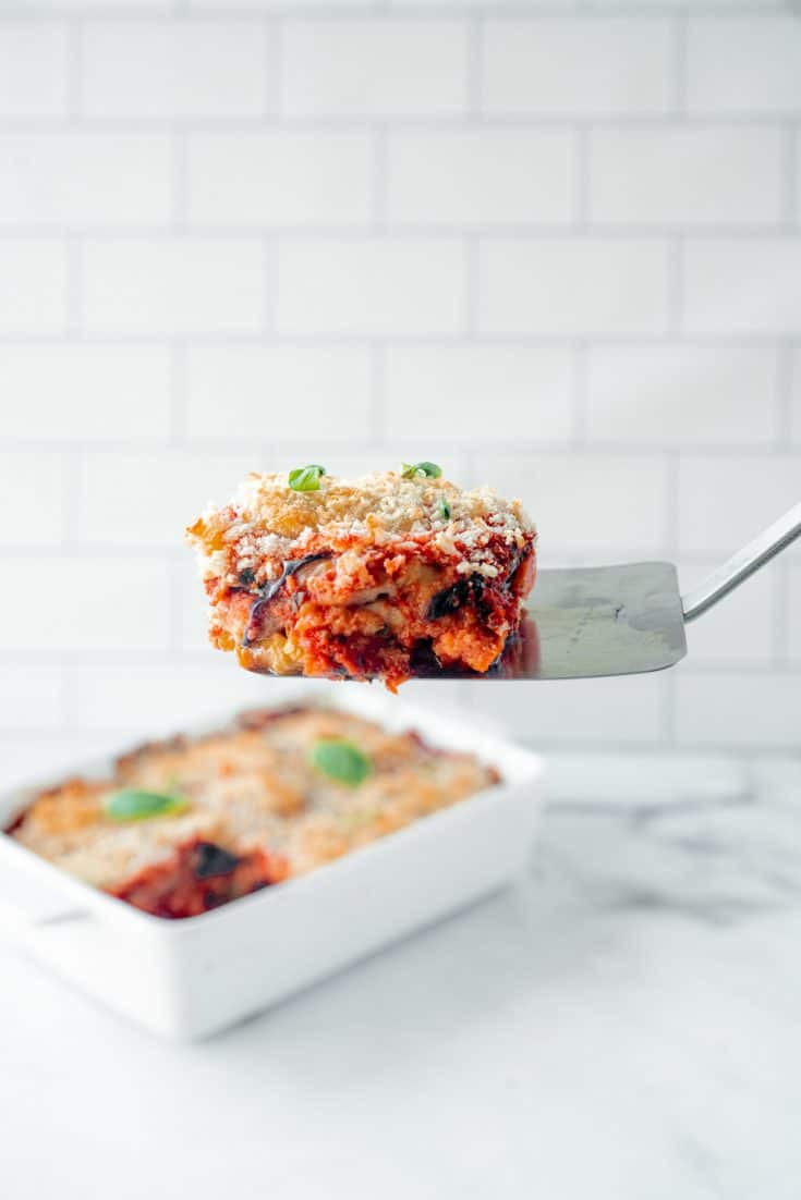 vegan eggplant parmesan being served on a spatula