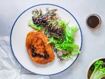vegan steak with lettuce and sauce