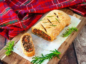 vegan wellington on cutting board with rosemary