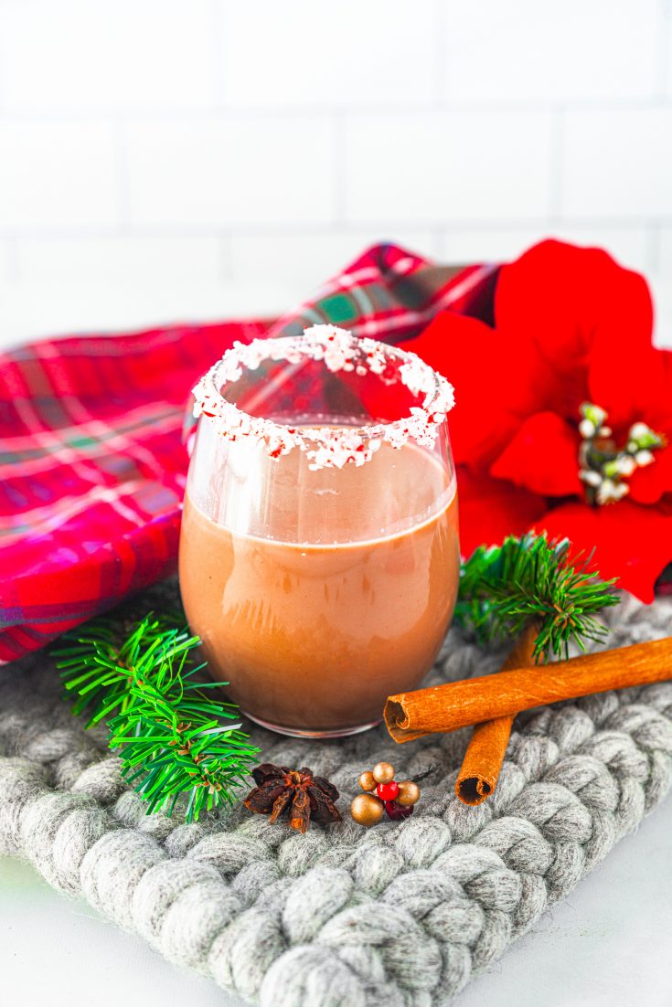 chocolate peppermint martini in serving glass with christmas decorations