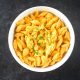 photo of large bowl of vegan butternut squash mac and cheese on black counter