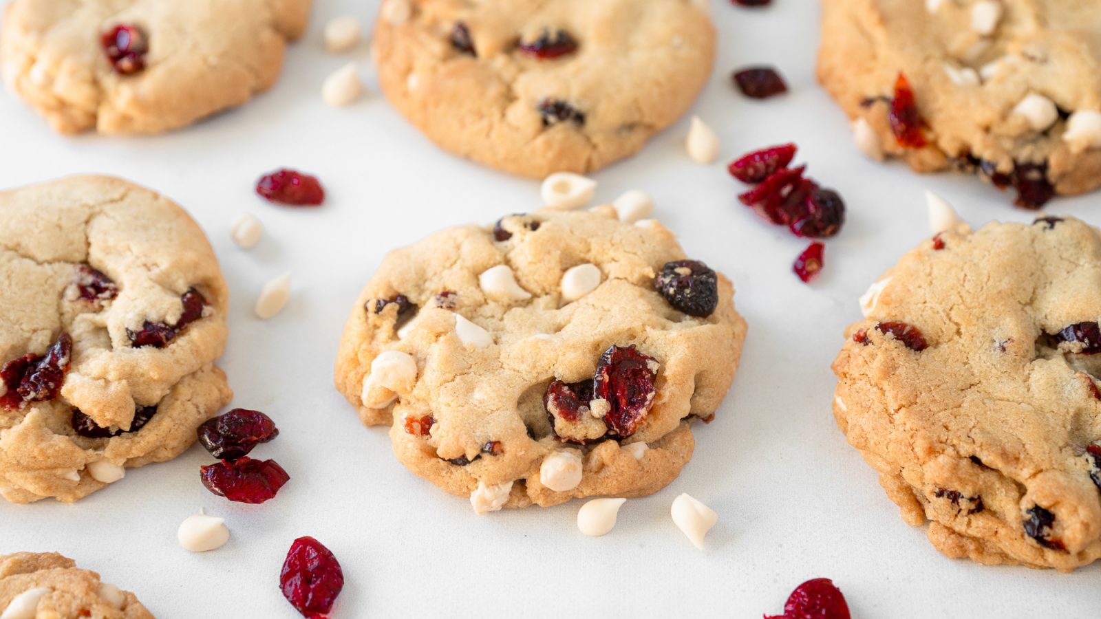 vegan cranberry cookies with white chocolate chips on baking tray