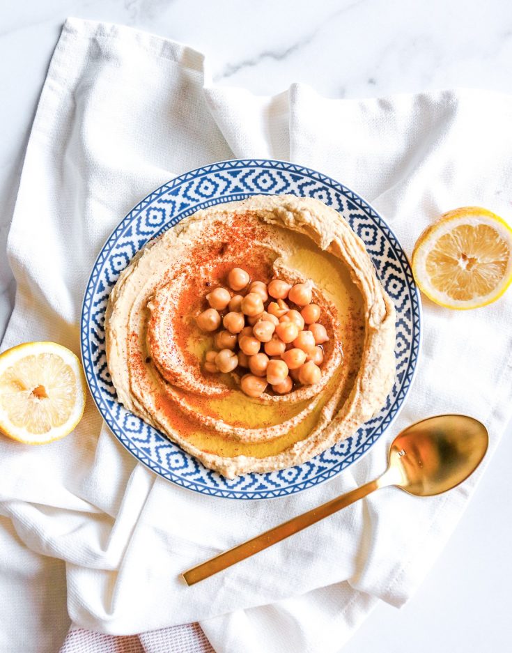 vegan hummus on serving tray with spoon