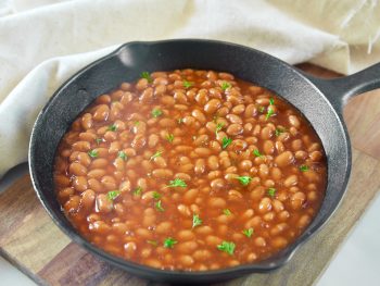 vegan baked beans recipe in a cast iron skillet for baking