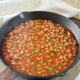 vegan baked beans recipe in a cast iron skillet for baking
