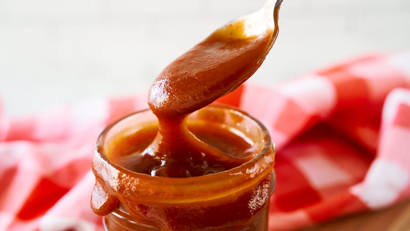 close up of vegan bbq sauce on a spoon