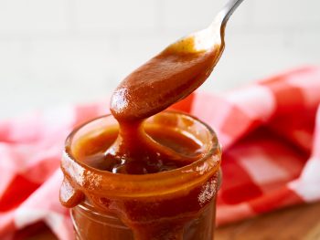 close up of vegan BBQ sauce on a spoon