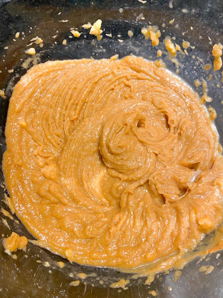 Ingredients mixed to a peanut butter color and consistency.