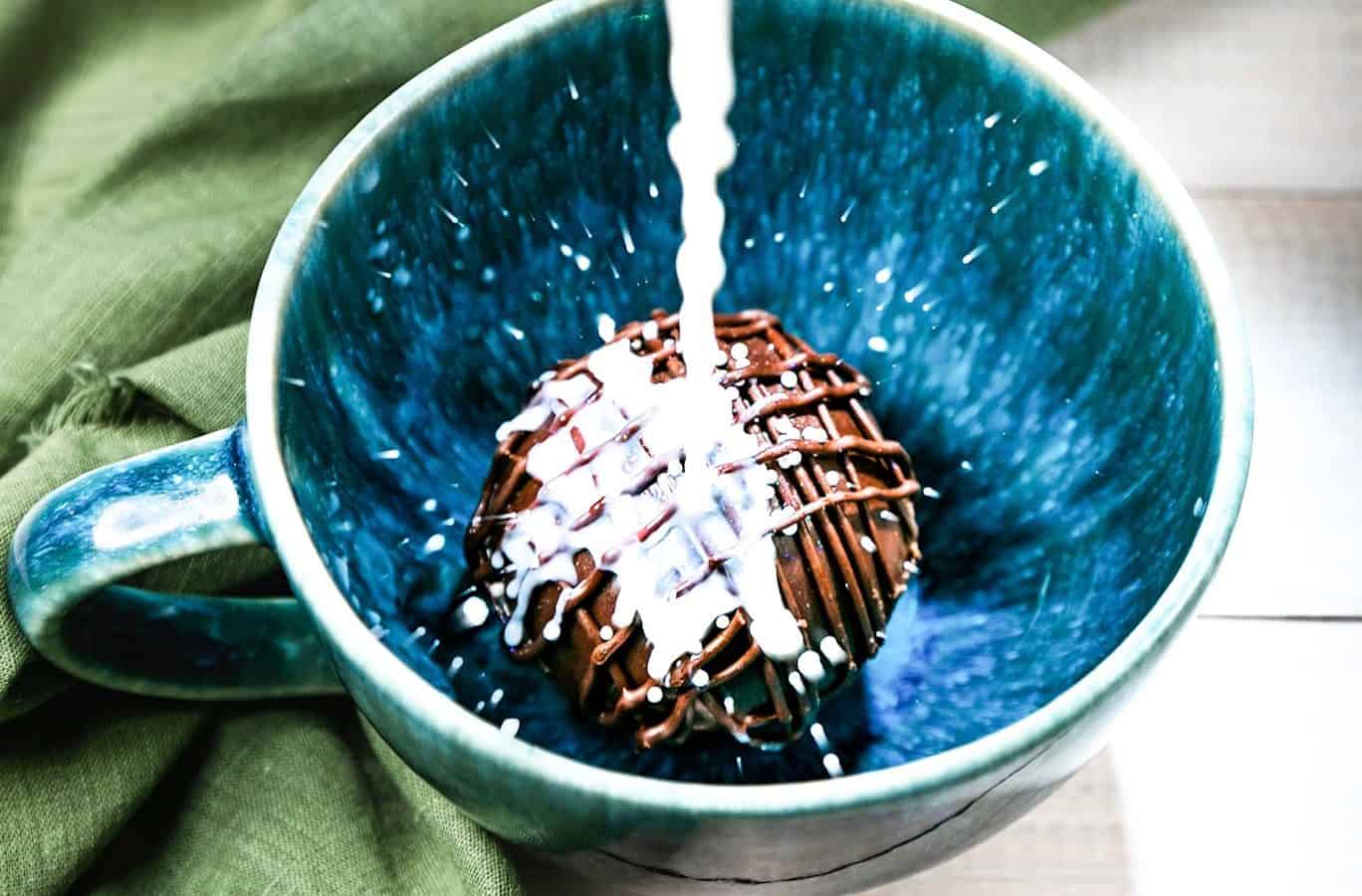 hot chocolate bomb getting non-dairy milk poured on it