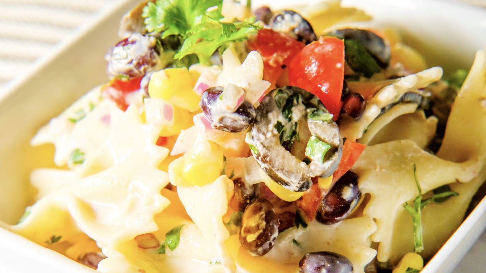 close up on mexican street corn pasta salad