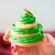 hand holding a stacked sugar cookie christmas tree