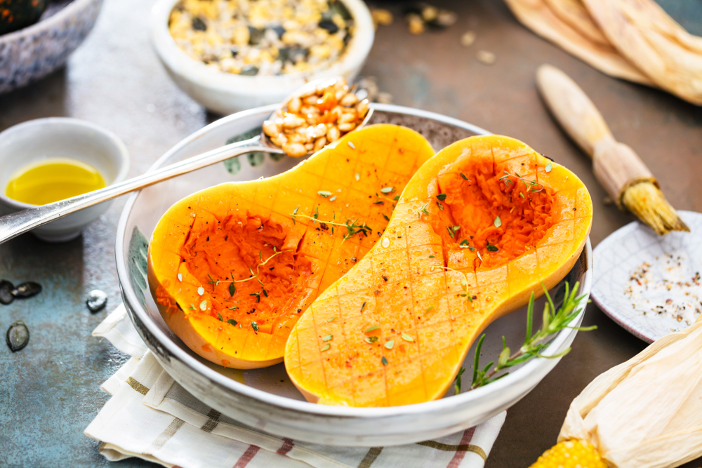 Butternut Squash  with different vegetables on the old wooden table top view Butternut