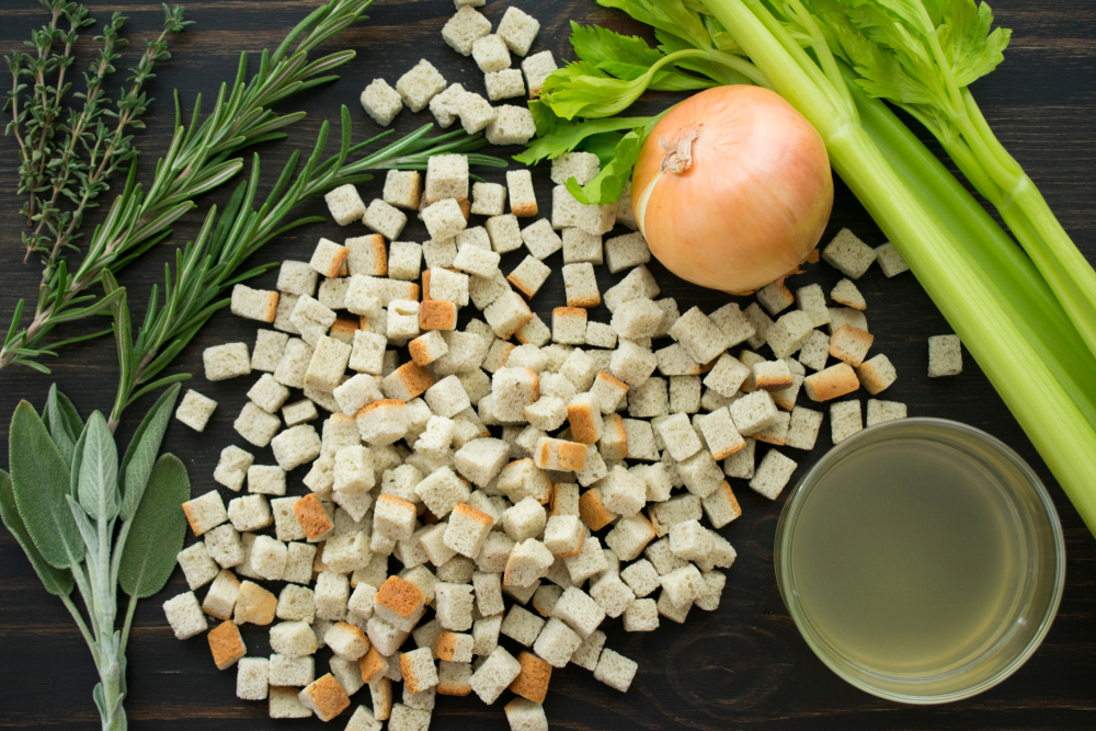 Thanksgiving Stuffing Ingredients on a Wood Background.