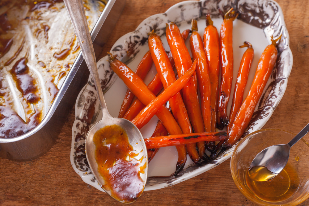 Glazed carrots on a serving dish perfect for a vegan Christmas dinner 