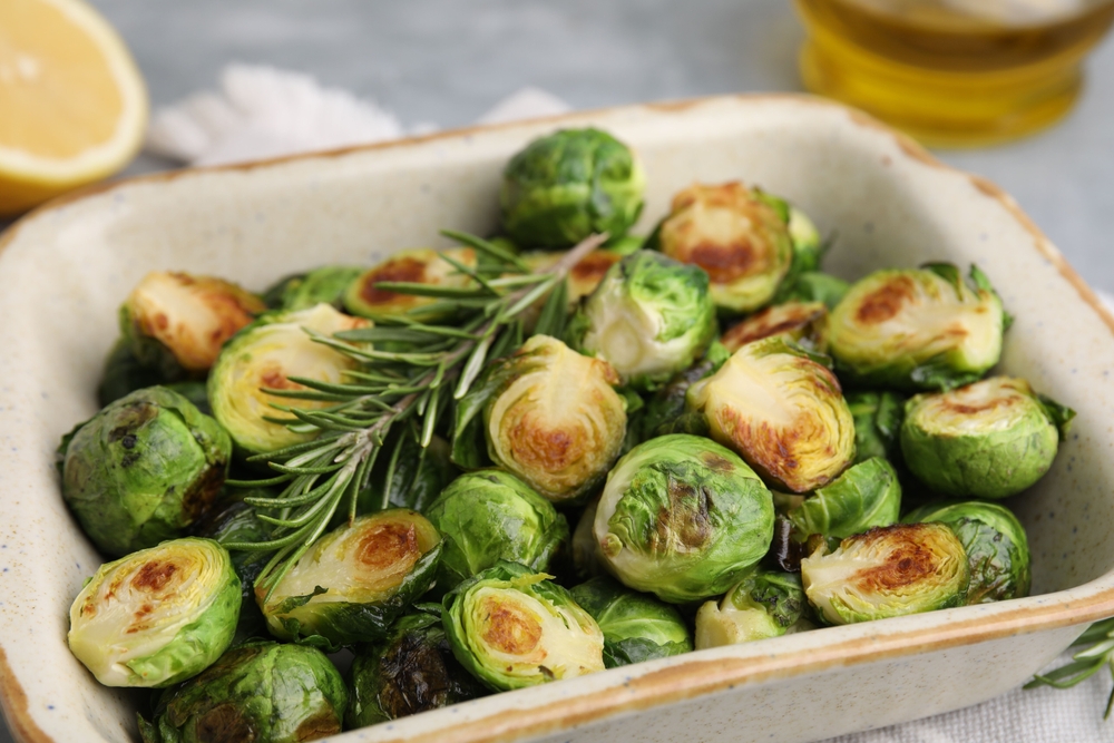 Roasted brussld sprouts in a serving container 