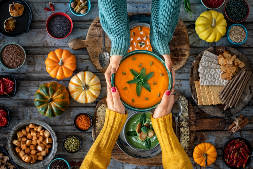 Two women eating their vegetable soups. Soups, suitable for vegans and vegetarians . 