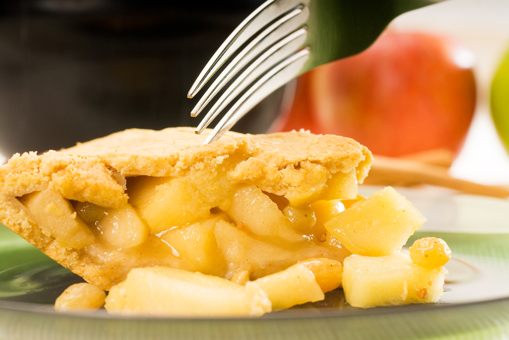fork digging into a piece of scrummy looking apple 