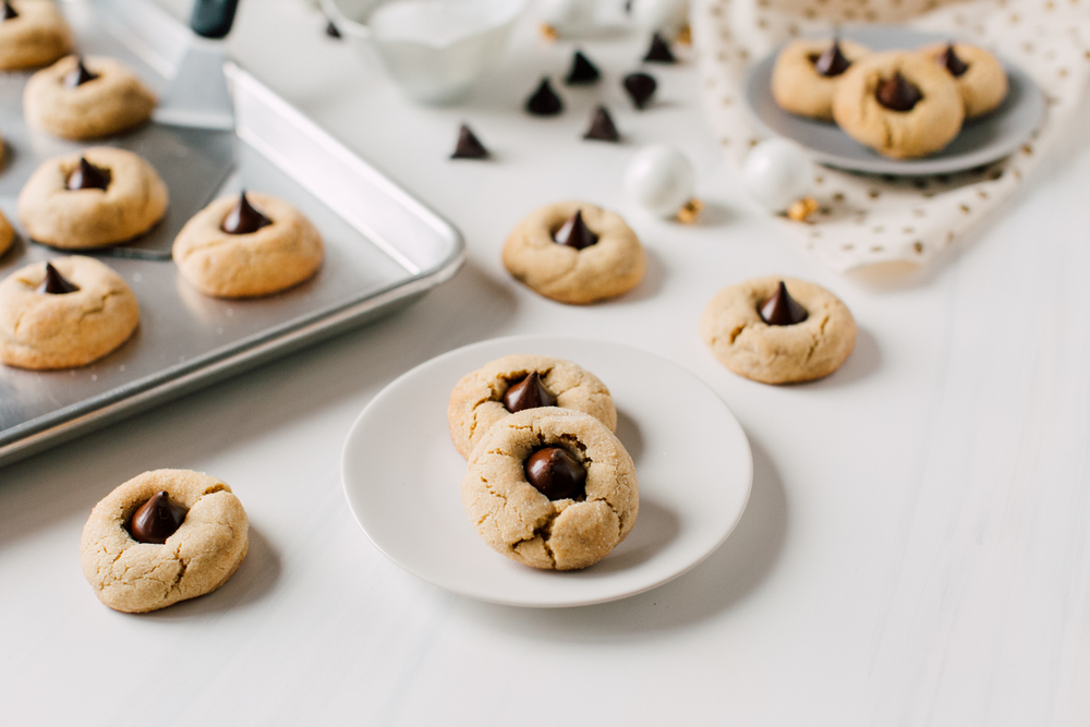 Peanut Butter Blossom Cookies Chocolate Food Styling with christmas baubles. 