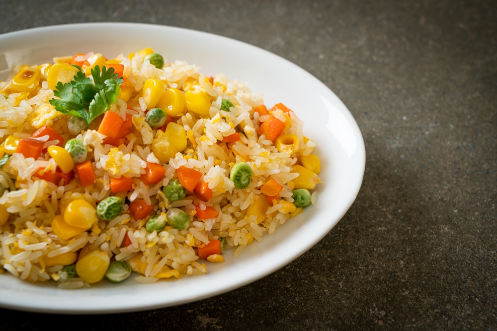 homemade fried rice with mixed vegetable (carrot, green bean peas, corn) and egg.