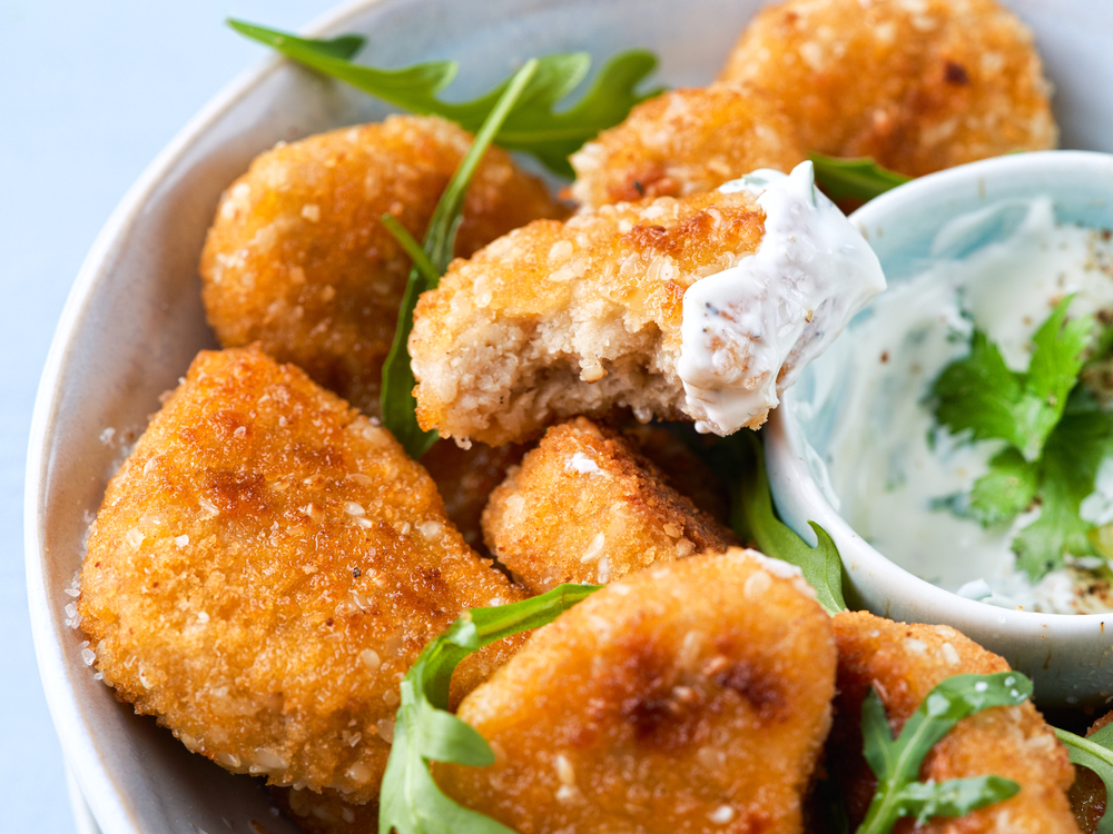 Close-up Vegetarian Nuggets, Vegan Dipping Sauce and rocket leaves on a light background, 