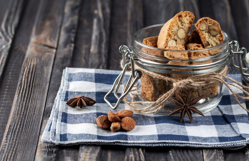 Traditional italian Christmas New Year dry cookies biscuits biscotti in glass jar.
