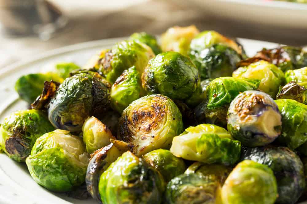 Healthy Roasted Brussel Sprouts for Thanksgiving Dinner close up. The article is a vegan brussels sprouts recipe.